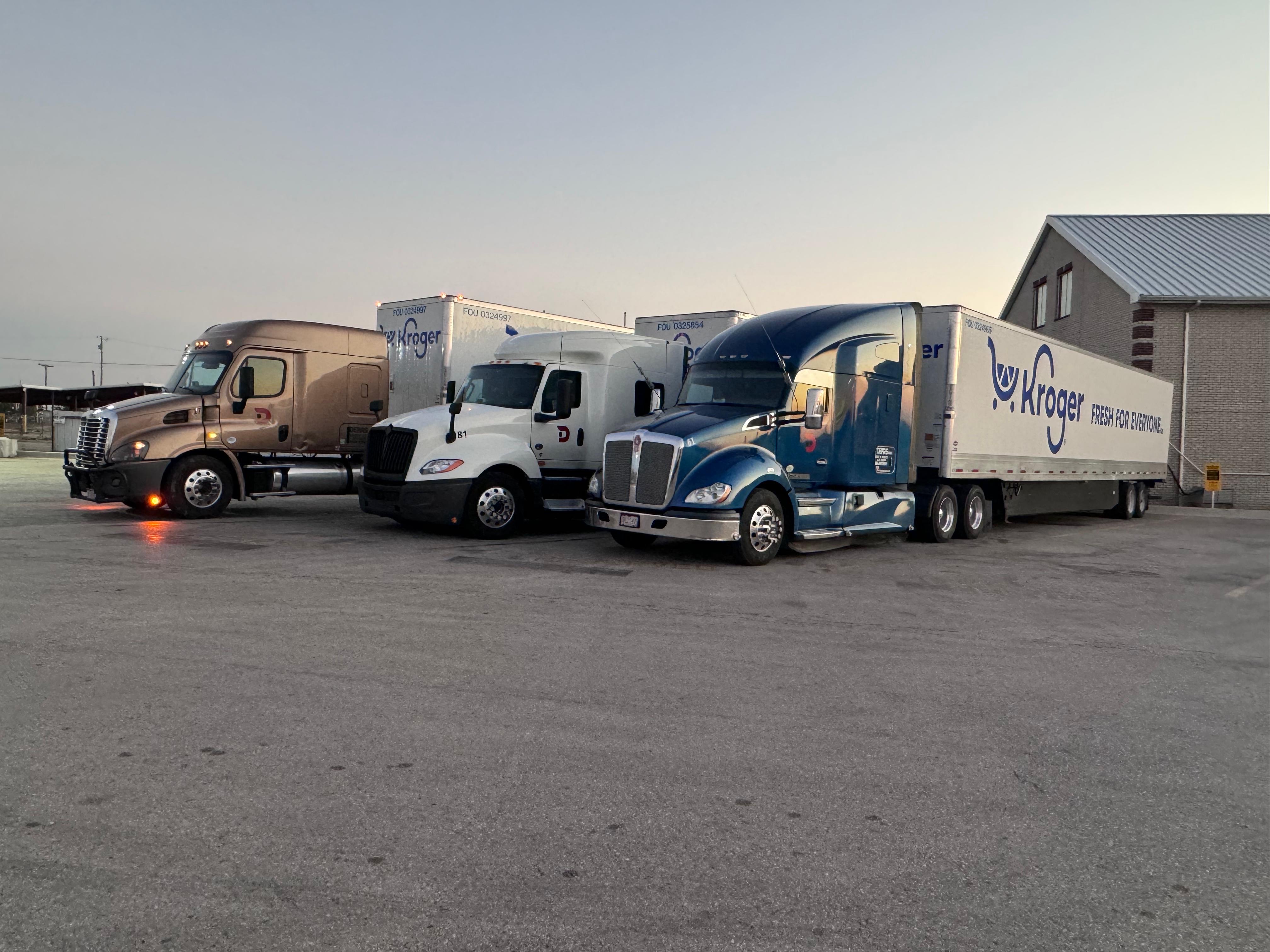 A Deras Trucking truck parked at a facility
